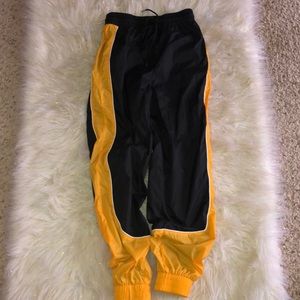 Black and yellow Forever21 windbreaker pants 👖